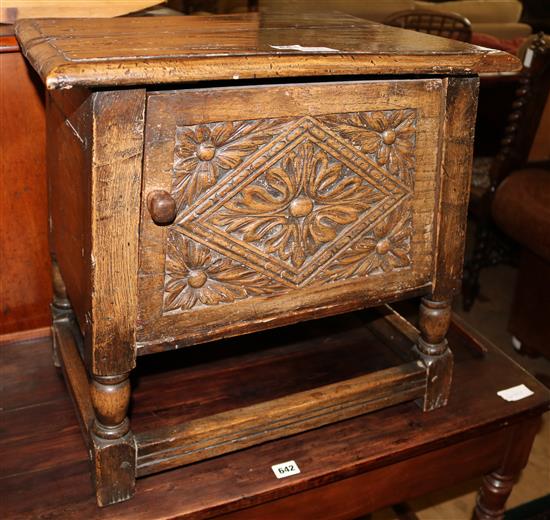A small carved oak cupboard